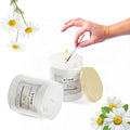 GoHooked VIME white chamomile scented aroma candle in a glass jar, lit with a match. 120 gm.