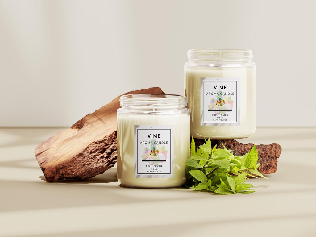 GoHooked ViMe Fruit Fusion aroma candle in a white glass jar with a wooden accent and green leaves.