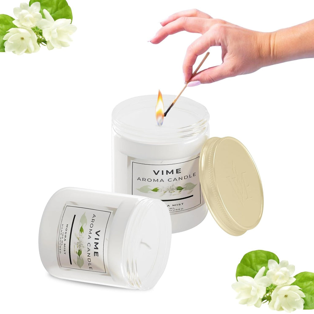 GoHooked ViMe Mogra Mist aroma candle in a white jar, lit with a match. 120 gm, 35 hr burn time.