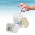 GoHooked ViMe Ocean Breeze scented candle in a white jar, lit with a match. Aromatherapy candle for home decor.