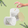 GoHooked ViMe Rosemary Reverie aroma candle in a white jar, lit with a match. 120 gm, 35 hr burn time.