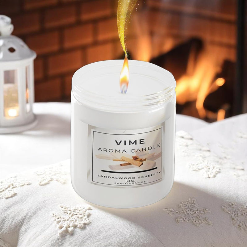 GoHooked ViMe Sandalwood Serenity aroma candle in a white jar, burning with a warm flame. Cozy home decor.