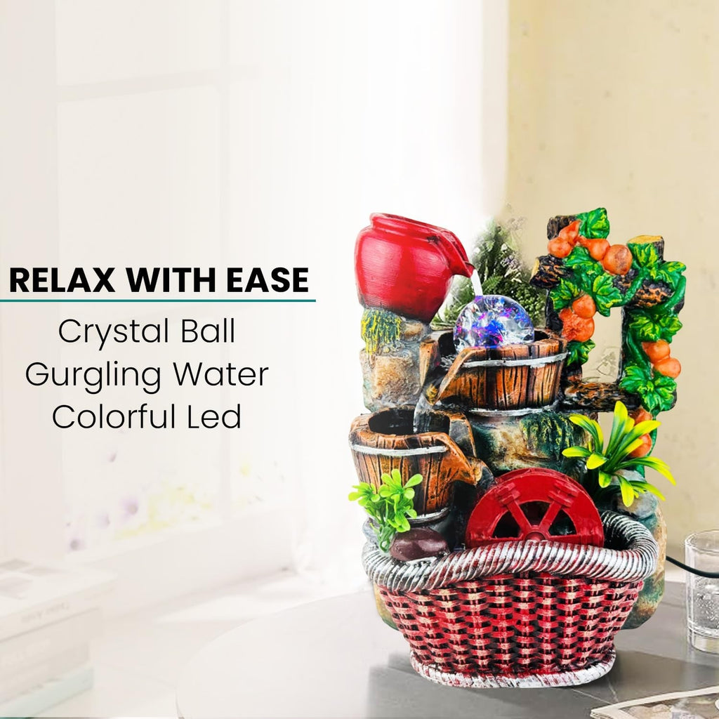 Go Hooked multicolour polyresin tabletop waterfall fountain with crystal ball and LED lights, featuring buckets and a red wheel.