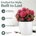 GoHooked white 10-inch Pluto Pot planter with pink hydrangeas. Made from durable, lightweight polymer, it's UV protected and weather-proof.