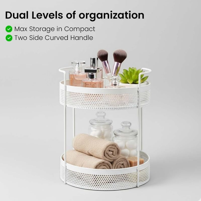 GoHooked white 2-tier metal mesh rolling cart with perfumes, makeup brushes, and decorative plant on top shelf. Bottom shelf holds rolled towels, jars of cotton balls, and soap.