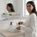 Go Hooked white 2-tier metal mesh countertop storage basket with soap, lotion, and towels