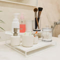 GoHooked white 2-tier metal standing rack organizer for countertop, bathroom, or vanity storage. Holds soap, makeup brushes, cotton swabs.