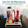 GoHooked white 3-tier iron countertop organizer rack holding toiletries and skincare bottles.