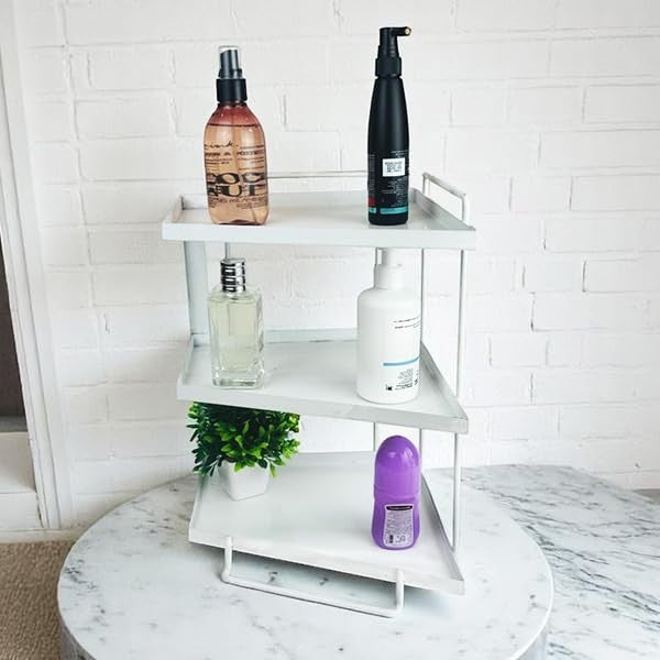 GoHooked white 3-tier iron countertop storage organizer with toiletries and a plant