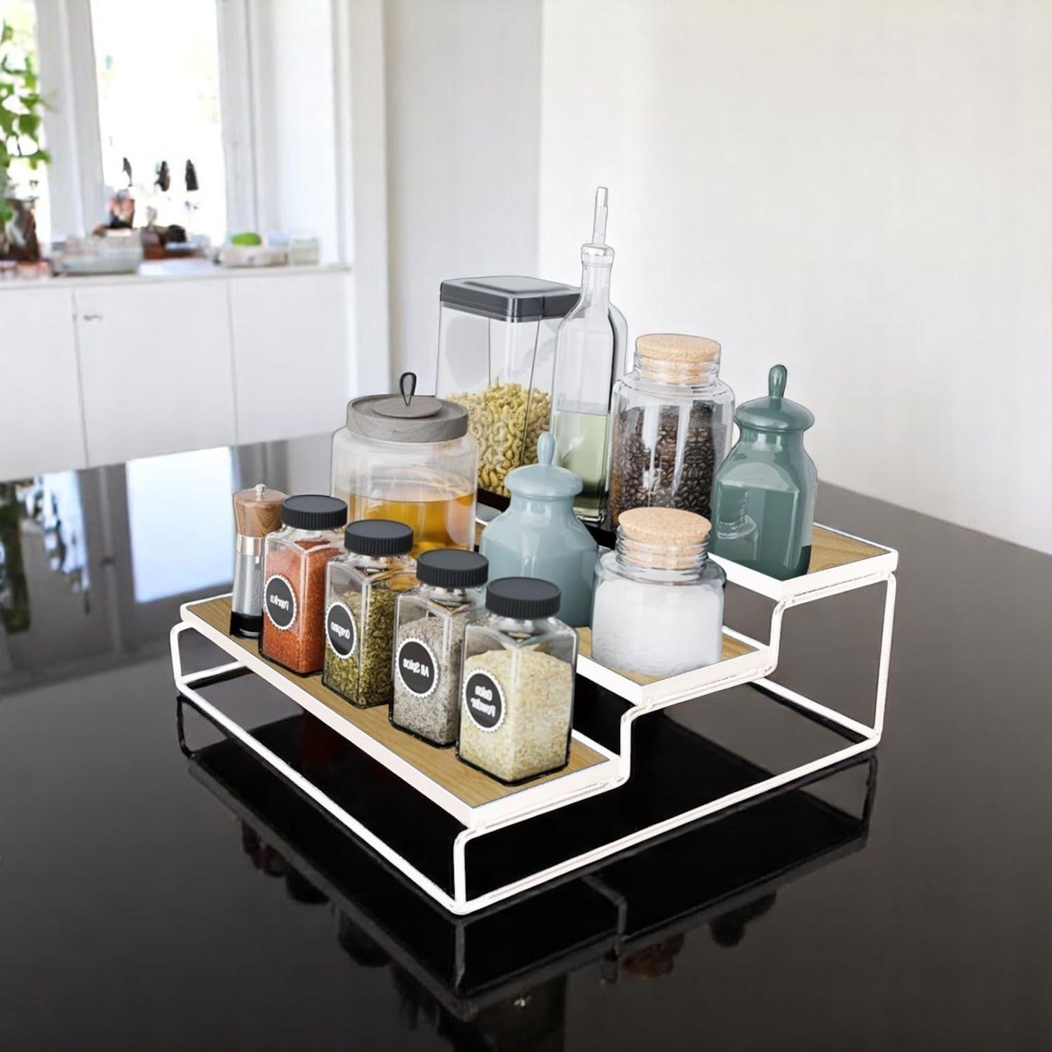 GoHooked white 3-tier iron countertop storage rack with wood-look shelves, holding spice jars and canisters.