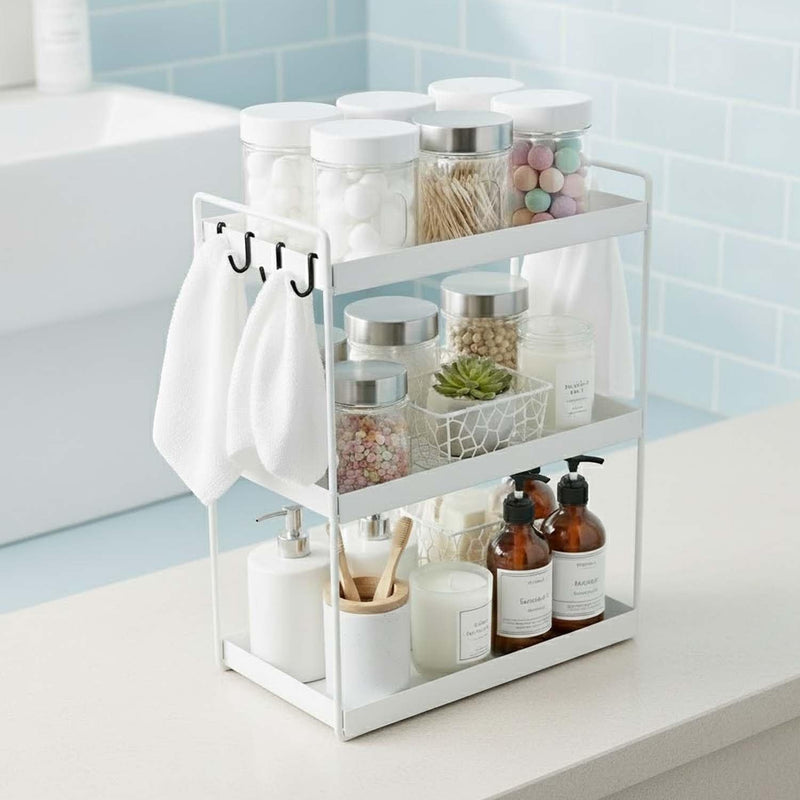 GoHooked white 3-tier standing iron rack organizer with hooks, holding bathroom and kitchen essentials.