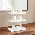 GoHooked white 3-tier metal vanity organizer with curved handles, holding skincare products and perfume.