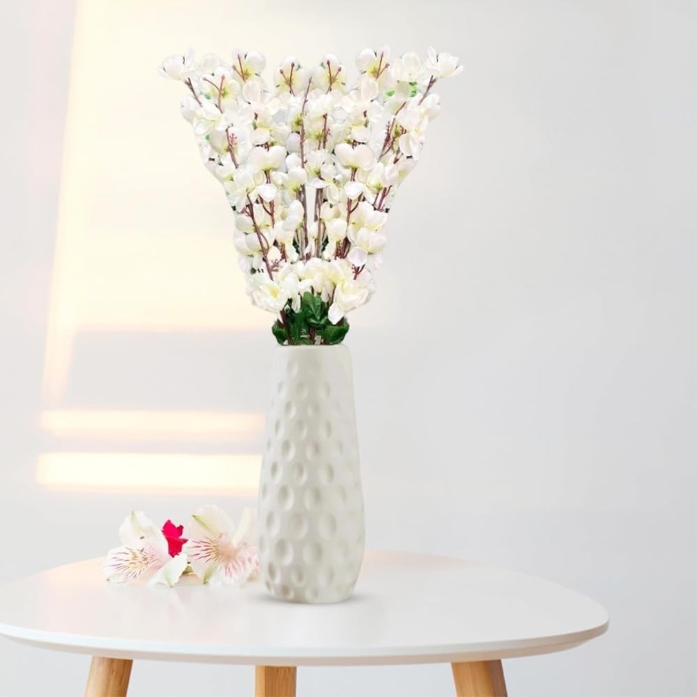 GoHooked white artificial flowers in a textured white ceramic vase, realistic faux blossoms for home decor.