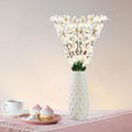 GoHooked white artificial flowers in a textured white vase, realistic faux blossoms for home and office decor.