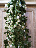 GoHooked white artificial orchid and rose flower garland with green leaves, made of silk and plastic, for home decor.