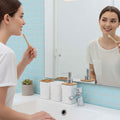 Go Hooked white plastic bathroom accessory set with heart embossed design, includes soap dispenser, tumbler, soap dish, and toothbrush holder.