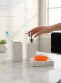 Go Hooked white ceramic 3-piece bathroom set with textured geometric pattern, includes soap dispenser, toothbrush holder, and soap dish.