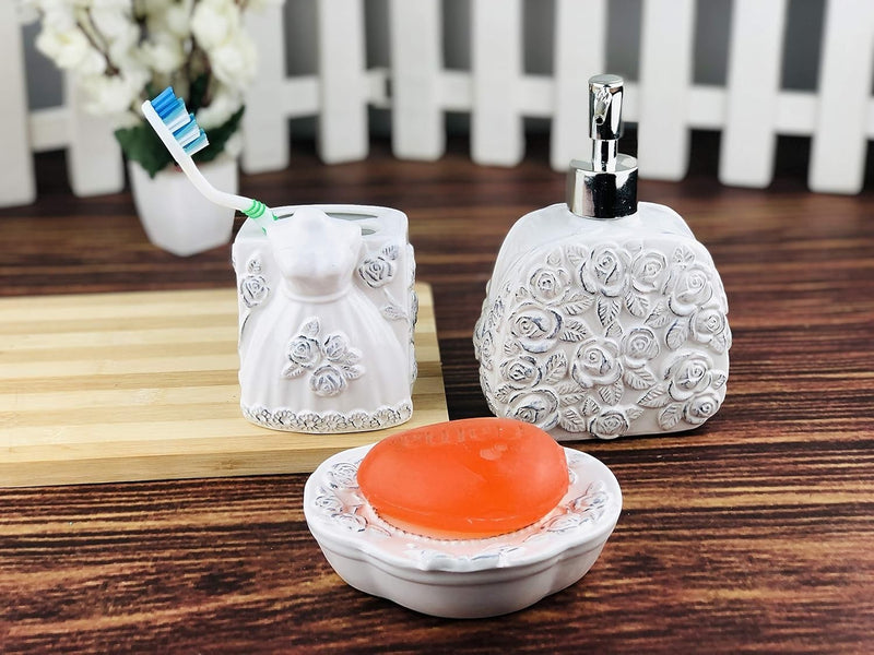 GoHooked white ceramic 3-piece bathroom set with rose and dress motifs, includes soap dispenser, toothbrush holder, and soap dish.