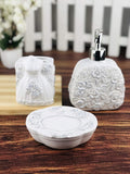 GoHooked white ceramic 3-piece bathroom set with rose and dress motifs, includes soap dispenser, toothbrush holder, and soap dish.