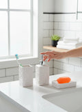 GoHooked white ceramic 3-piece bathroom set with textured pattern, includes soap dispenser, toothbrush holder, and soap dish.