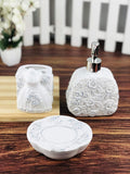 GoHooked white ceramic 3-piece bathroom set with rose embossed details, includes soap dispenser, toothbrush holder, and soap dish.