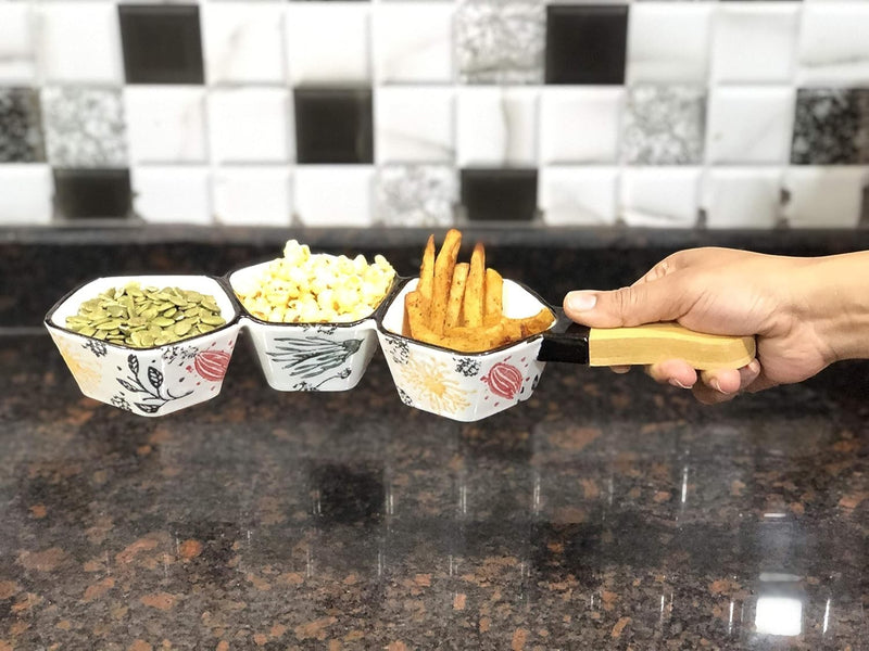 Go Hooked white ceramic snack serving platter with three compartments, one holding pumpkin seeds, one popcorn, and one french fries.