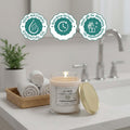 GoHooked white glass jar candle with Kashmiri Snow scent, 100% natural essential oil, 40-hour burn time.