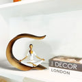 GoHooked white and gold polyresin meditating woman yoga statue with intricate detailing, perfect for home or office decor.