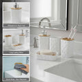 Go Hooked white plastic 4-piece bathroom set with heart embossed design: soap dispenser, toothbrush holder, tumbler, and soap dish.