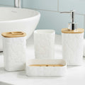 Go Hooked white plastic bathroom accessory set with heart embossed design, includes soap dispenser, tumbler, soap dish, and toothbrush holder.