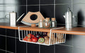 Go Hooked white powder-coated iron under-shelf basket filled with strawberries, apples, plums, and kiwis.