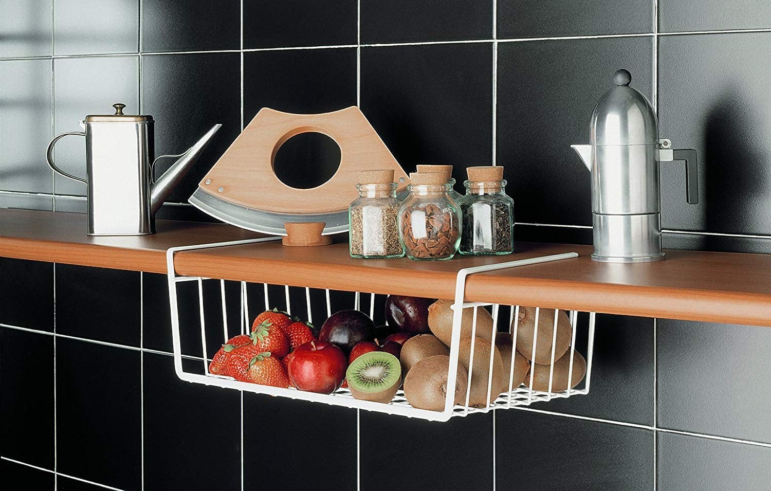 Go Hooked white powder-coated iron under-shelf basket filled with strawberries, apples, plums, and kiwis.