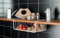 Go Hooked white powder-coated iron under-shelf basket holding strawberries, apples, plums, and kiwis.