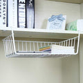 Go Hooked white powder coated iron under shelf basket with grid pattern, holding books and a tablet.