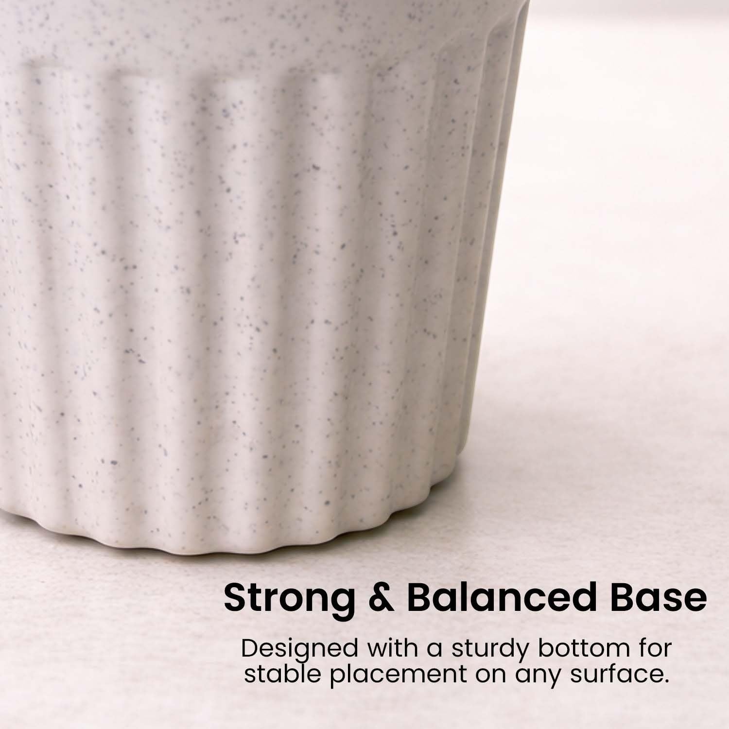 GoHooked white marble texture plastic plant pot with ribbed design and a strong balanced base.