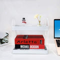 GoHooked white metal 2-tier standing rack organizer with books, snowman, and flowers on a desk.