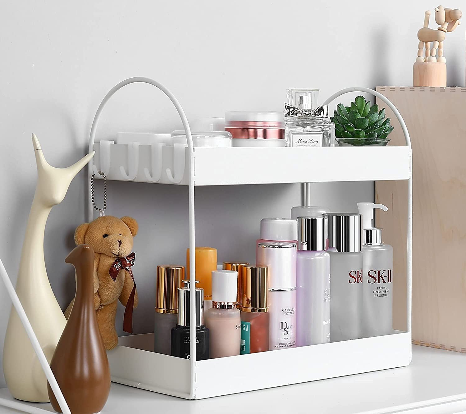 GoHooked white metal 2-tier standing rack organizer for bathroom or kitchen countertop storage. Features hooks on top tier.