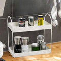 GoHooked white metal 2-tier standing rack organizer for kitchen or bathroom countertop storage. Holds spices, cosmetics, and more.