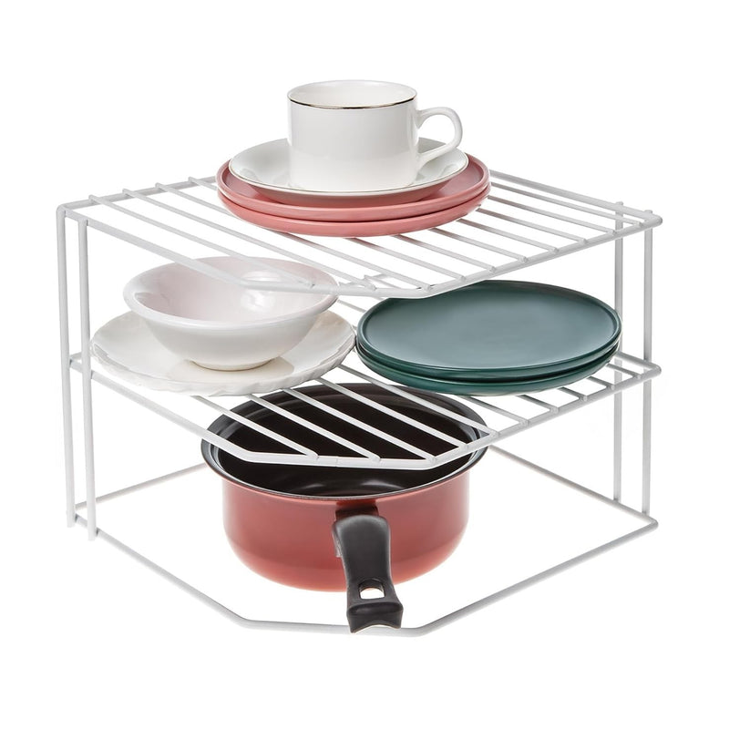 Go Hooked white metal 3-tier corner shelf organizer holding dishes, bowls, a cup, and a small pot.