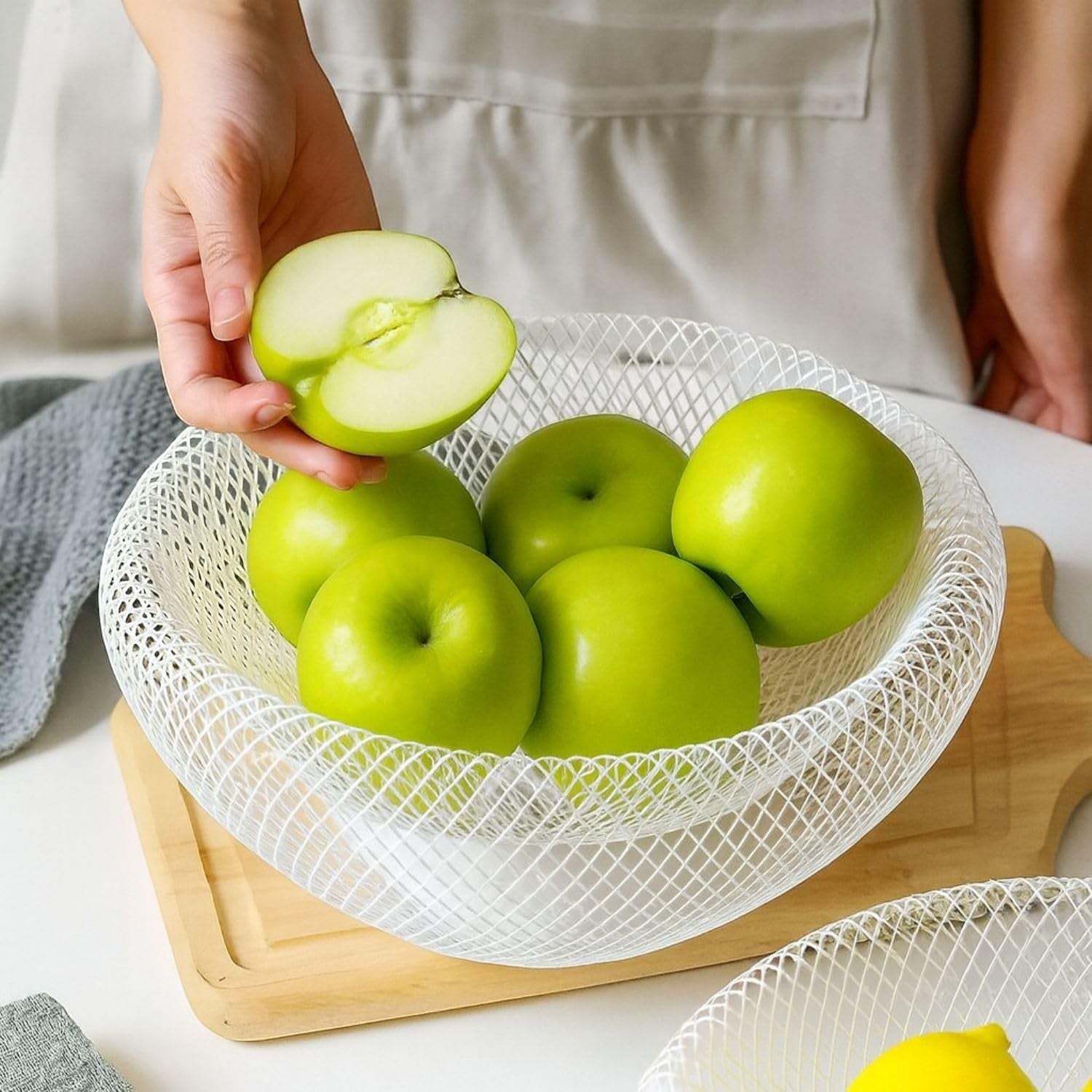 Go Hooked white metal mesh fruit bowl with a double-layer design, keeping fruits fresh and insect-free.