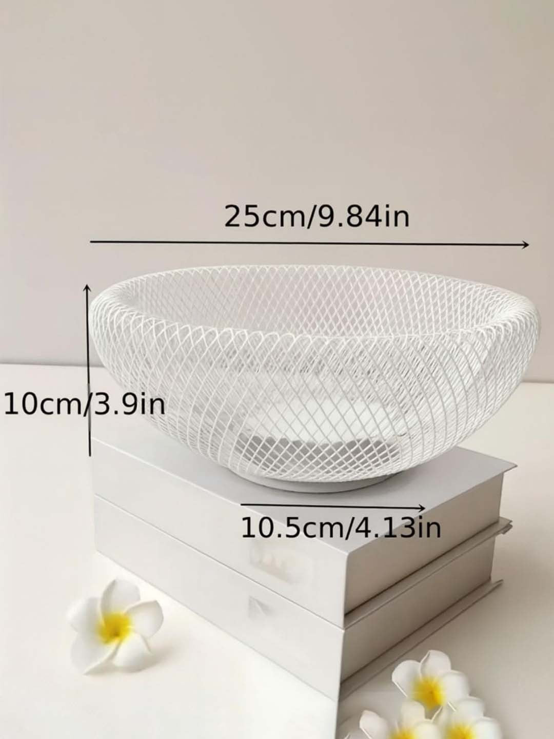 GoHooked white metal mesh fruit bowl with dimensions shown on a white surface with decorative flowers.