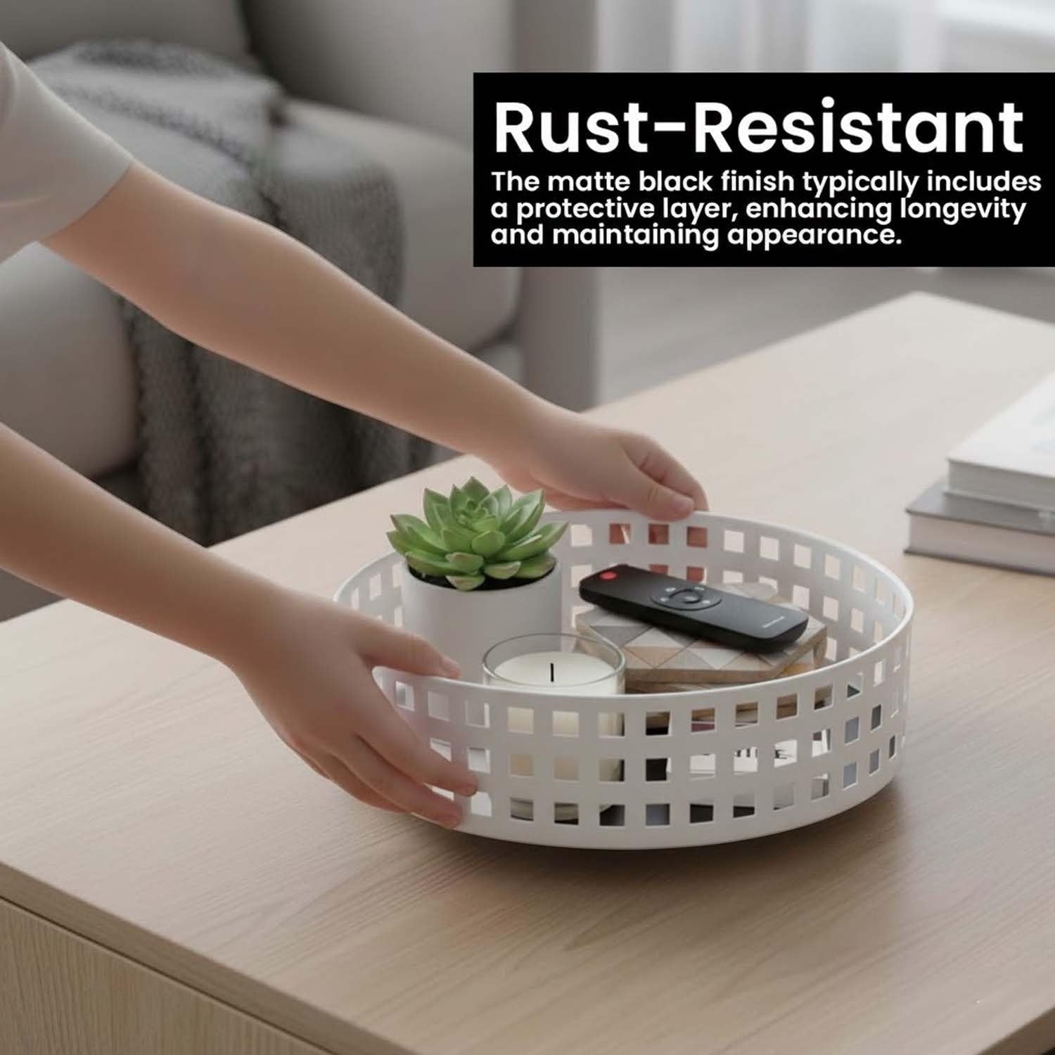 Go Hooked white metal revolving fruit basket with a grid pattern, holding a plant, candle, and remote.