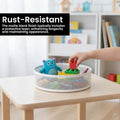 Go Hooked white metal revolving organizer basket filled with toys and a plush monster.