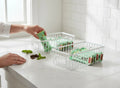 GoHooked white metal wire grid storage basket bin with handles, pack of 2, holding mint chocolate bars.
