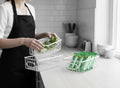 GoHooked white metal wire grid storage basket with handles, used for organizing kitchen items.