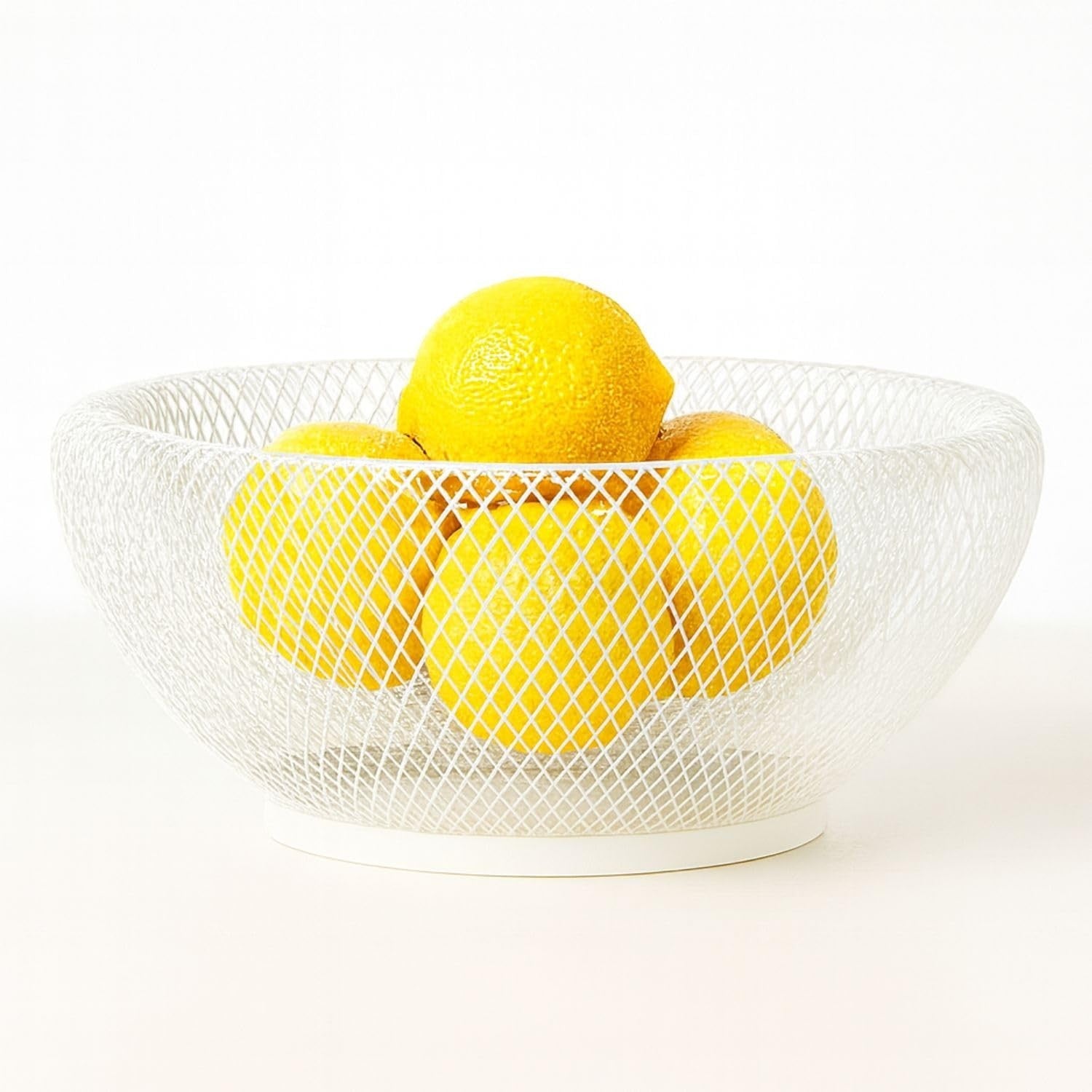 GoHooked white metal wire fruit basket with a diamond pattern, holding fresh lemons. Ideal for kitchen counter storage.