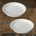 GoHooked white 10-inch round planter drip trays, pack of 8. Modern style, UV resistant, lightweight plastic for indoor/outdoor use.