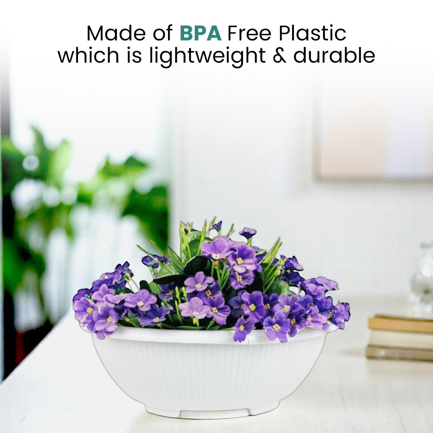 GoHooked white round plastic bonsai planter pot holding purple flowers on a white table for home and office decor