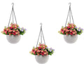 Go Hooked white plastic hanging pot with woven texture, filled with pink and purple flowers.