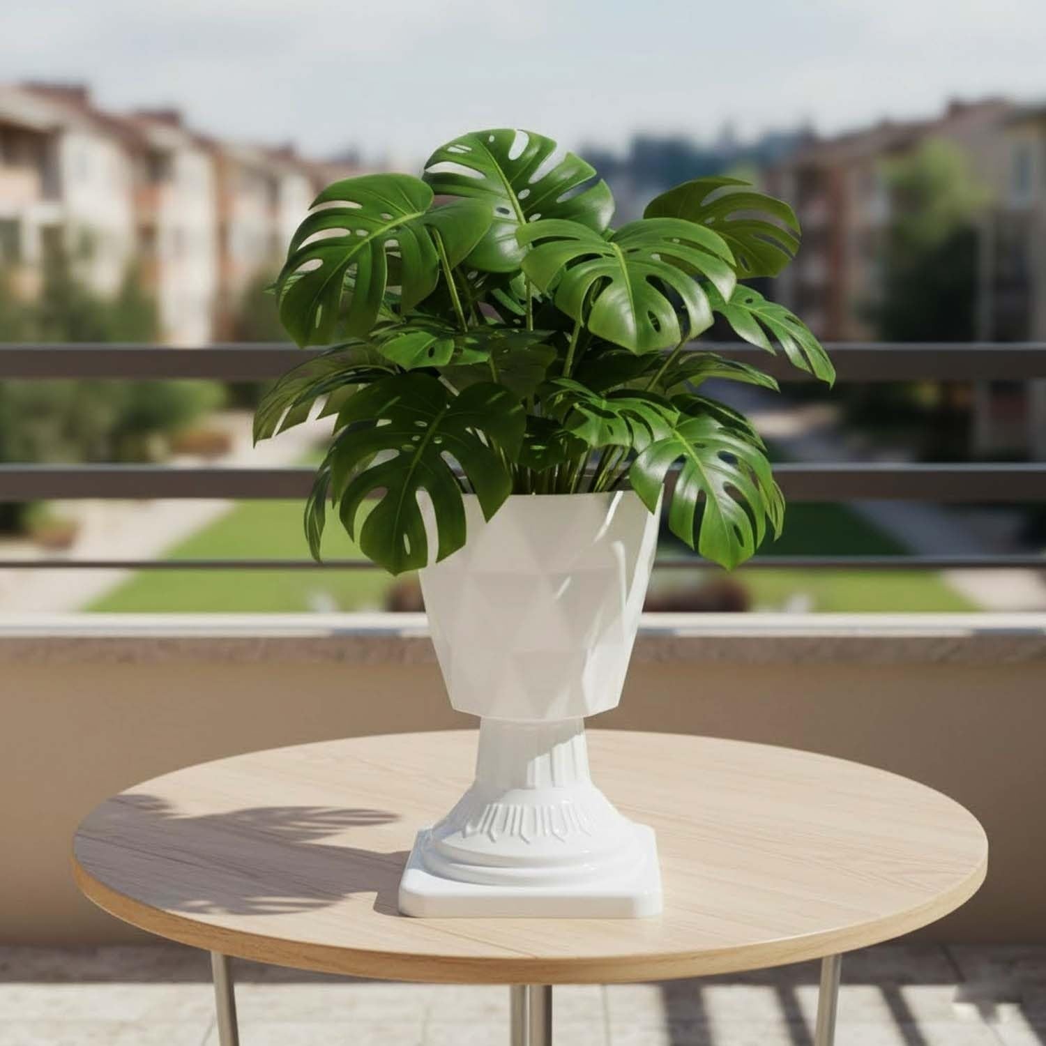 GoHooked white plastic planter with pedestal stand, featuring a diamond-cut design and a monstera plant.